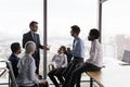 Team leader lead corporate meeting with multiethnic teammates in office Royalty Free Stock Photo