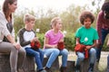 Team Leaders With Group Of Children On Outdoor Activity Trip Toasting Marshmallows Over Camp Fire Royalty Free Stock Photo