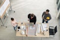 Team of male and female engineers and architects, working team, meeting, discussing construction and drawing construction plans, Royalty Free Stock Photo