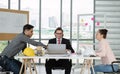 Team of male and female engineers and architects, working team, meeting, discussing construction and drawing construction plans, Royalty Free Stock Photo