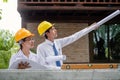 Team of male and female engineers and architects, working team, meeting, discussing construction, and inspecting the outdoor Royalty Free Stock Photo