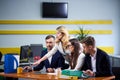 Team of mature women and men at meeting table discussing a business plan Royalty Free Stock Photo