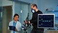 Team of medial researcher monitoring vo2 of man Royalty Free Stock Photo