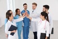 Team of medical workers holding hands together. Unity concept Royalty Free Stock Photo