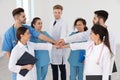 Team of medical workers holding hands together. Unity concept Royalty Free Stock Photo