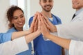 Team of medical workers holding hands together. Unity concept Royalty Free Stock Photo