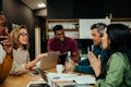 Team meeting during lunch break in office lounge briefing before big presentation with boss Royalty Free Stock Photo