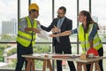 Team of multiethnic architects working on construction plans in meeting room. Engineers discussing on project in office. Mature Royalty Free Stock Photo