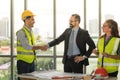 Team of multiethnic architects working on construction plans in meeting room. Engineers discussing on project in office Royalty Free Stock Photo