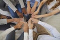 Team of multiracial business people joining their hands to show concept of teamwork and support Royalty Free Stock Photo