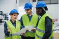 Team of multiracial engineers working in robotic factory Royalty Free Stock Photo