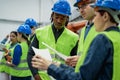 Team of multiracial engineers working in robotic factory Royalty Free Stock Photo