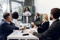 Team of multiracial five business people, healthcare experts, having video conference meeting with young, pretty African