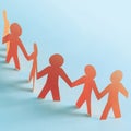 Team of paper doll people holding hands Royalty Free Stock Photo