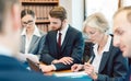 Team of partners in a law firm working diligently on a case Royalty Free Stock Photo