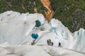 Team of People Climbing Glacier