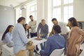 Team of people having conversation with senior business man during meeting in office Royalty Free Stock Photo