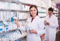 Team of pharmaceutist and technician working in chemist shop Royalty Free Stock Photo