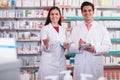 Team of pharmaceutist and technician working in chemist shop Royalty Free Stock Photo