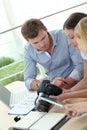 Team of photo journalists working at office Royalty Free Stock Photo