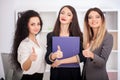 Team portrait of happy businesswomen standing on office corridor Royalty Free Stock Photo