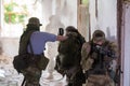A team of professional airsoft players clear the location from opponents.