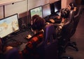 A team of professional cyber sportmans, trains for the championship, plays in a multiplayer video game on pc in a gaming