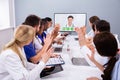 Team Of Professional Doctors Having Video Conference Royalty Free Stock Photo