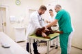 Team of professional veterinarian doing ultrasound exam to dog