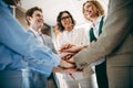 Team of professionals in a modern workplace shows camaraderie and support through teamwork building activities Royalty Free Stock Photo