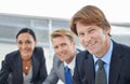 Team of professionals. Portrait of three businesspeople sitting together.