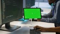 Team of programmer using green screen tablet, working in server farm Royalty Free Stock Photo