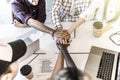 Team put hands together, show connection and alliance, top view of working table. Teambuilding in office, young businessmen and Royalty Free Stock Photo