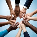 A team putting their hands in the middle, symbolising diversity of culture and ethnicity Royalty Free Stock Photo