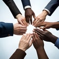 A team putting their hands in the middle, symbolising diversity of culture and ethnicity Royalty Free Stock Photo