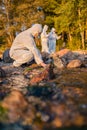 Team of researchers analyzing water sample at seashore Royalty Free Stock Photo