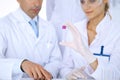 Team of scientific researchers in laboratory studying substances or blood sample. New vaccine for pharmacology industr Royalty Free Stock Photo