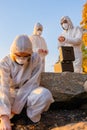 Team of scientist collecting water sample at seashore Royalty Free Stock Photo