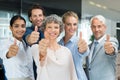 Team showing thumbs up Royalty Free Stock Photo