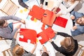 Team sitting behind desk, checking reports, talking. Top View Royalty Free Stock Photo