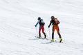 Team ski mountaineers climb the mountain on skis. Team Race ski mountaineering. Russia, Kamchatka