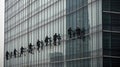 A group of window washers cleaning a skyscraper created with Generative AI