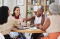 Team of smiling diverse business women shaking hands in office after meeting in boardroom. Group of happy professionals Royalty Free Stock Photo