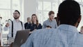 Team spirit at healthy workplace. Happy young boss businessman leading modern office meeting slow motion RED EPIC. Royalty Free Stock Photo