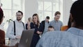 Team spirit at healthy workplace. Happy young boss businessman leading modern office meeting slow motion RED EPIC. Royalty Free Stock Photo