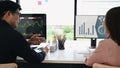 Team of stock trader checking and analyzing financial graph on computer together in office. Royalty Free Stock Photo