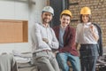 team of successful architects in hard hats looking Royalty Free Stock Photo