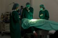 A team of surgeons in the operating room . A team of doctors standing in a hospital. Group of doctors wearing masks in the operati Royalty Free Stock Photo