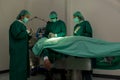 A team of surgeons in the operating room . A team of doctors standing in a hospital. Group of doctors wearing masks in the operati Royalty Free Stock Photo