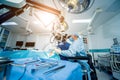 A team of surgeons performing brain surgery to remove a tumor. Royalty Free Stock Photo